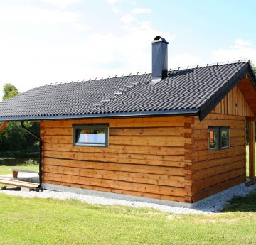 Log sauna with tiled roof